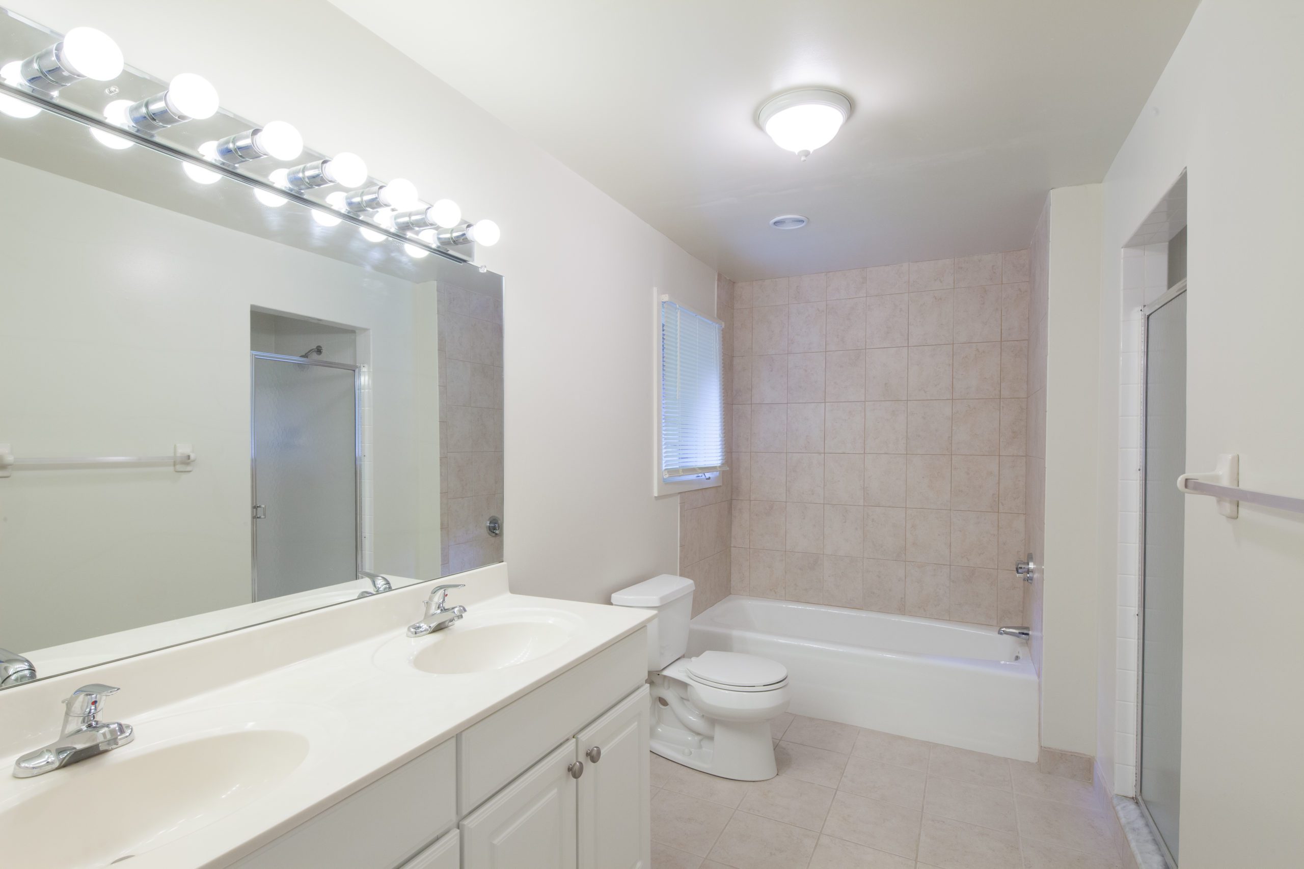 203 Living - Montoya apartment bathroom with dual sink and large mirror in Brandord, CT